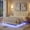 White, variant on Queen Size Upholstered Floating Bed Frame with LED Lights, PU Leather Platform Bed with Button-Tufted Headboard, Easy Assembly, No Box Spring Needed, White