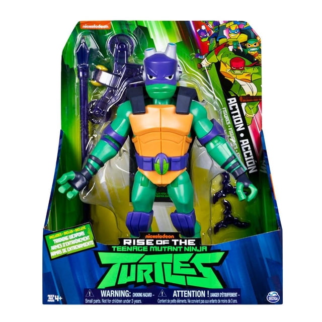 donatello spin master rise of the mutant ninja turtles 11 pulgadas figura de acción en empaque frontal, vista centrada y de frente con máscara morada, caparazón y pechera naranja, piel verde y 13 puntos de articulación; accesorios translúcidos visibles en blister y gráficos de Nickelodeon y Spin Master Games. A menudo usada para exhibir en estanterías de colección por su tamaño compacto.