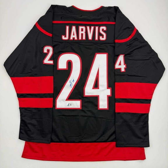 Autographed/Signed Seth Jarvis Carolina Black Hockey Jersey Beckett BAS COA