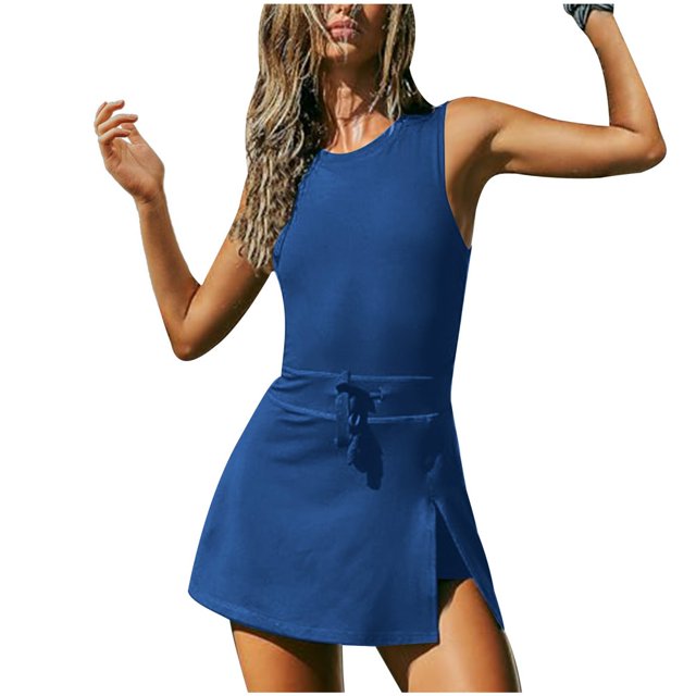 JUNWELL BLVB Womens Athletic Romper Workout Outfits Tennis Dresses Backless Exercise Golf Skorts Jumpsuits for Summer. A sleeveless blue athletic romper with a slim fit, featuring a tie waist and a skirt overlay with a side slit. Designed for sports like tennis, golf, and gym workouts, offering comfort and flexibility with its breathable, stretchable fabric.