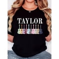 thumbnail image 1 of T-shirt pour Femmes, "Rangée de Guitares Taylor" Imprimé, Mode Minimaliste Rétro, Col Rond, Décontracté et Confortable, T-shirt à Manches Courtes Sportif pour la Fête des Pères, Fête des Mères, Nouvel An, Festival de Printemps, Vale, 1 of 6