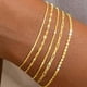 thumbnail image 1 of Pulseras de oro para mujer, pulseras apilables chapadas en oro de 14 quilates para mujer, juego de pulseras de oro de moda, pulseras de cadena impermeables, clip de papel, tenis ajustable, minimalist, 1 of 5