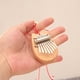 thumbnail image 4 of Instrumento musical Madera de caoba Pulgar Dedo Piano Mbira Mini 8 teclas Kalimba Barbie Nuevos Originales, 4 of 8