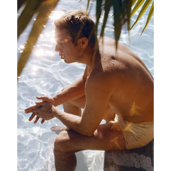 Steve McQueen in swimshorts relaxing by his pool 1960's rare image 24x36 poster