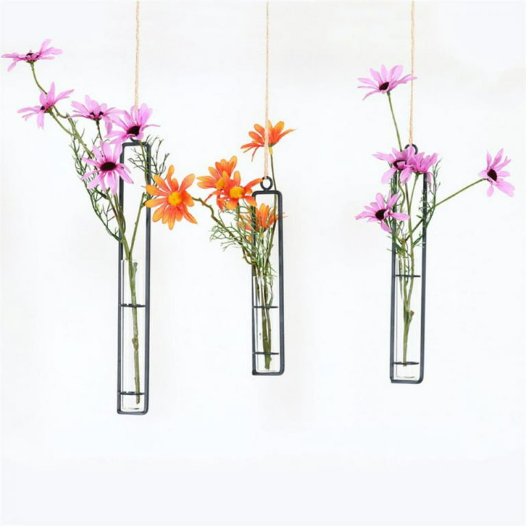 Flowers in glass hanging tubes