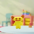 thumbnail image 3 of Fuggler 2.5 Inch Vinyl Figure | Tan/Yellow, 3 of 5