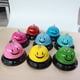 thumbnail image 3 of Campana de mano con forma de cara sonriente de metal para entrenamiento de mascotas, barra de servicio para restaurante, campana de convocatoria, contestador automático de competición, mesa, 3 of 6