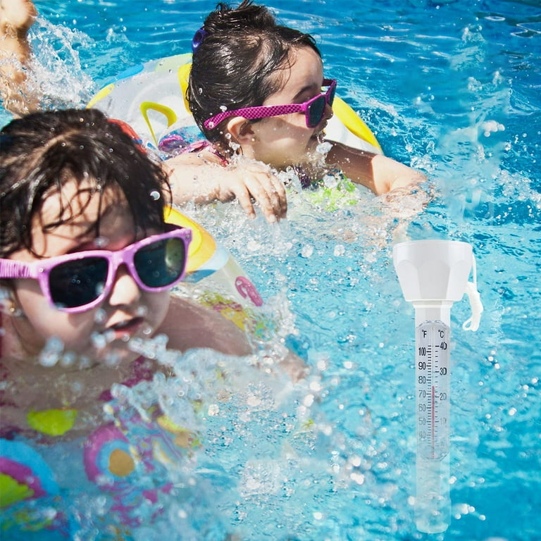 Reading a water thermometer in swimming pool, checking water