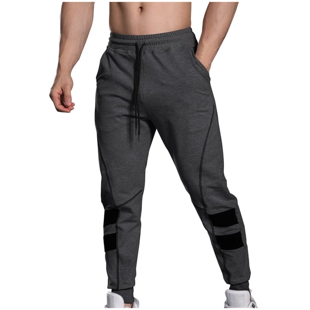 Pantalones largos de moda para hombre, casuales, de color sólido, con cintura elástica y bolsillos, con pernera ajustada, pantalones largos de poliéster y algodón para hombre.
