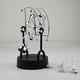 thumbnail image 1 of Péndulo de equilibrio de física de Newton eléctrico, lindo adorno de figura de delfín, juguete de la suerte de movimiento perpetuo, decoración para el hogar y la oficina, 1 of 11