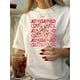 thumbnail image 1 of Camiseta Para Mujer Verano Suave Camiseta Con Cuello Redondo Para Mujer Para Caminar Por La CalleWomen's Retro Casual Round Neck T-Shirt with Pink Bow and Heart Print, Short Sleeves, Polyester - Mac, 1 of 6