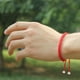 thumbnail image 5 of 12 pulseras de hilo rojo hechas a mano para mujer, con dijes trenzados, ajustables, para parejas (rojas), 5 of 5