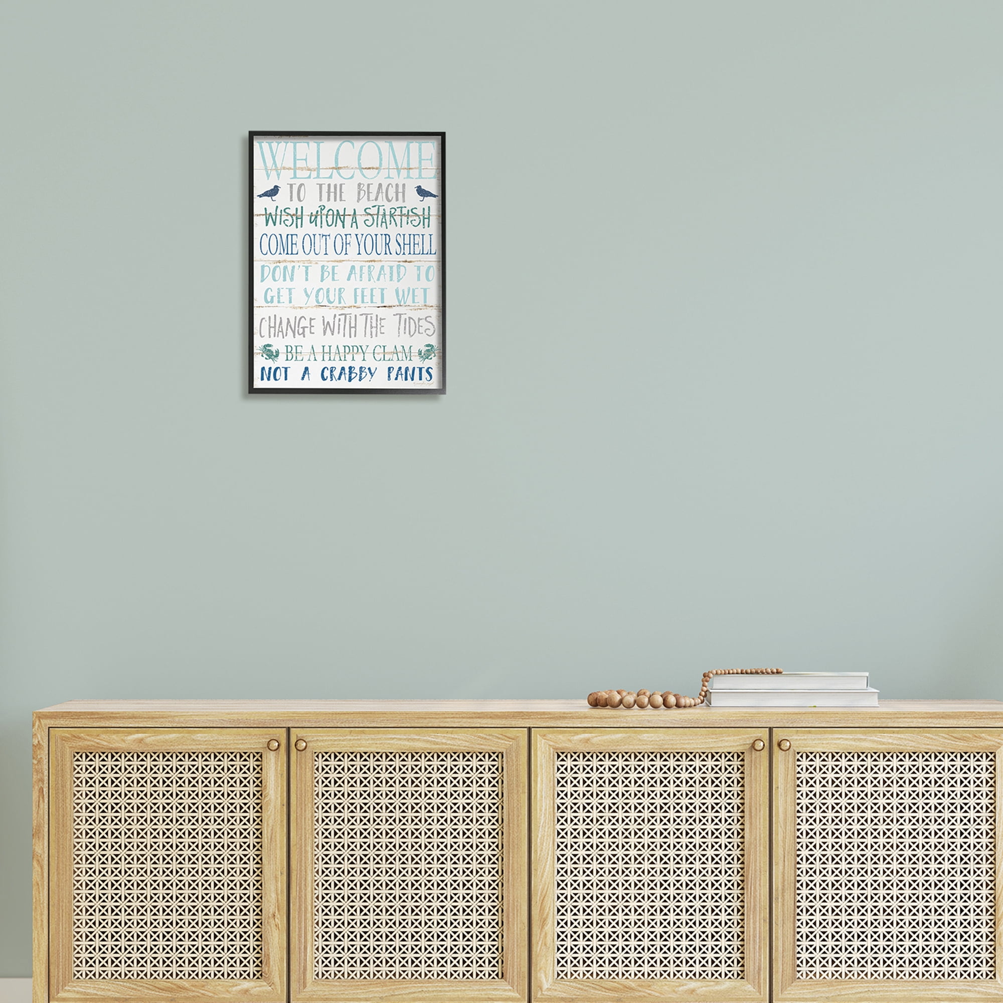 The Stupell Home Decor Welcome to the Beach Blue Aqua and White Planked Look Sign