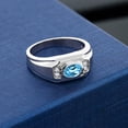 thumbnail image 3 of Gem Stone King Men's 925 Sterling Silver Swiss Blue Topaz and White Created Sapphire Ring (1.66 Cttw, Gemstone November Birthstone, Oval 8X6MM,, Size 12), 3 of 3