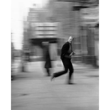- 1970s Blur Motion Man Running Down City Street Looking Over His Shoulder Fear Crime Print By Vintage Collection