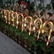 thumbnail image 3 of Muleta solar tricolor de Papá Noel con forma de estrella, copo de nieve, mango de paraguas, caramelo, luz LED para césped para exteriores, 3 of 6