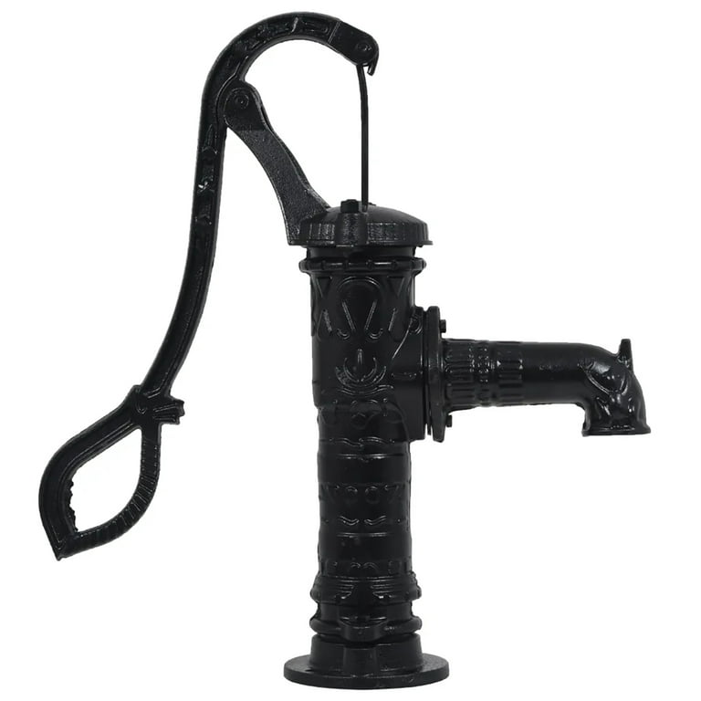 An old fashioned hand powered water pump in a garden in black and
