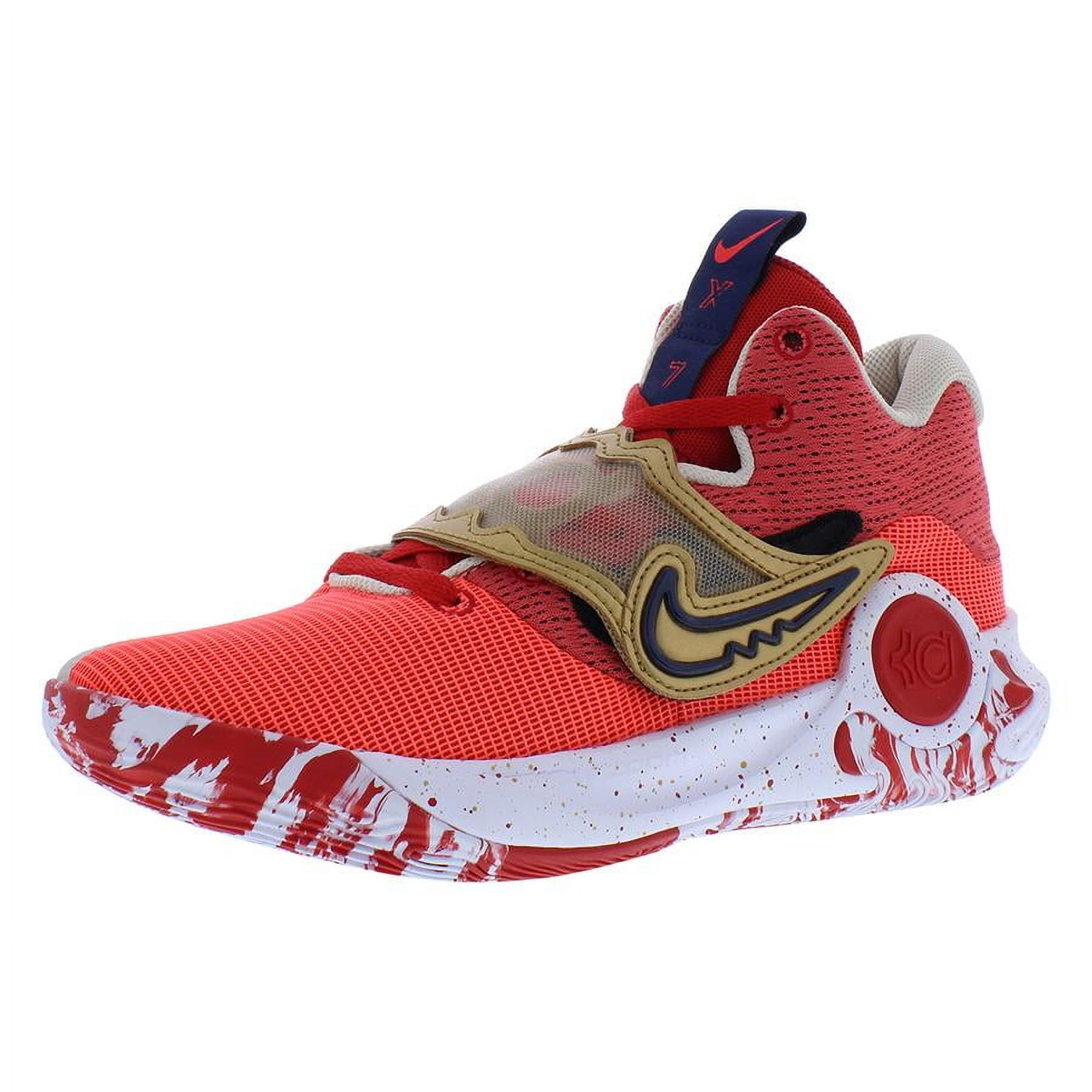 gold and red nike shoes