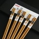 thumbnail image 4 of Fiudx Juego de Palillos Japoneses de Madera, Agarre Antideslizante, Madera Natural, Fáciles de Limpiar, Reutilizables, Ideales para Sushi, Fideos, Bento, Uso Doméstico y En Restaurantes, Juego de 5 P, 4 of 7