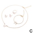 thumbnail image 1 of Joyería de estilo coreano para mujer, conjunto de cuatro piezas con collar, pulsera, pendientes y anillo, con diseño de mariposa y gota de aceite rosa y fragancia pequeña., 1 of 7