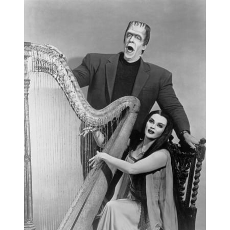 - Publicity Still from The Munsters Herman & Lily with Harp Photo Print