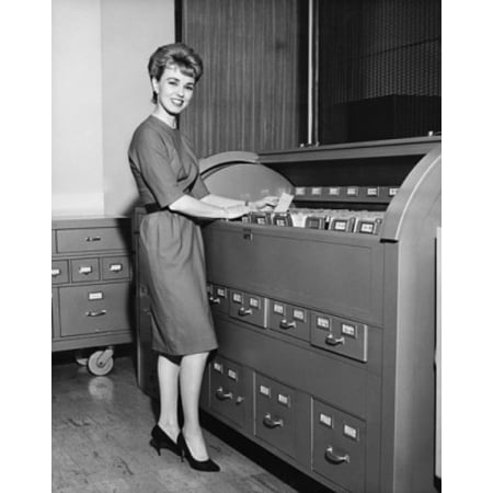 Insulated Holding Cabinet - Portrait of a businesswoman holding a document beside a filing cabinets Stretched Canvas - (24 x 36)