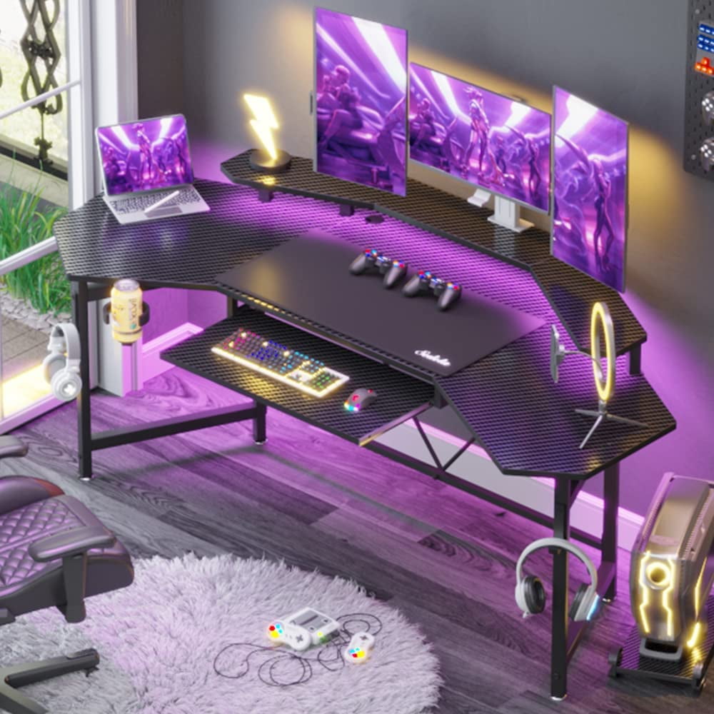 Premium Photo  A gaming room with a pink and blue led light that is lit up  with a black keyboard and a monitor.