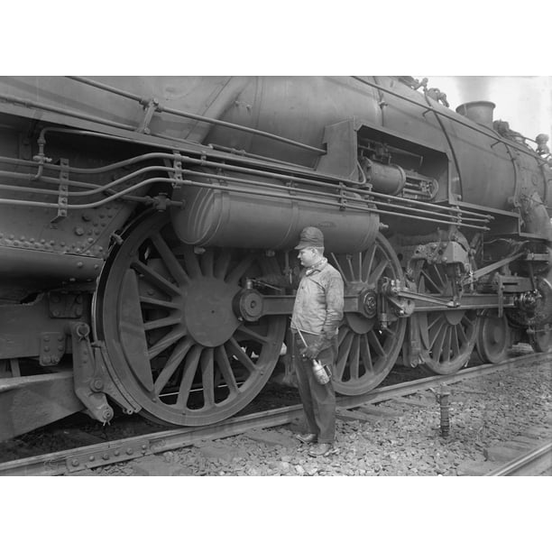 mechanic servicing a railway steam engine in 1924 massive locomotive mechanic