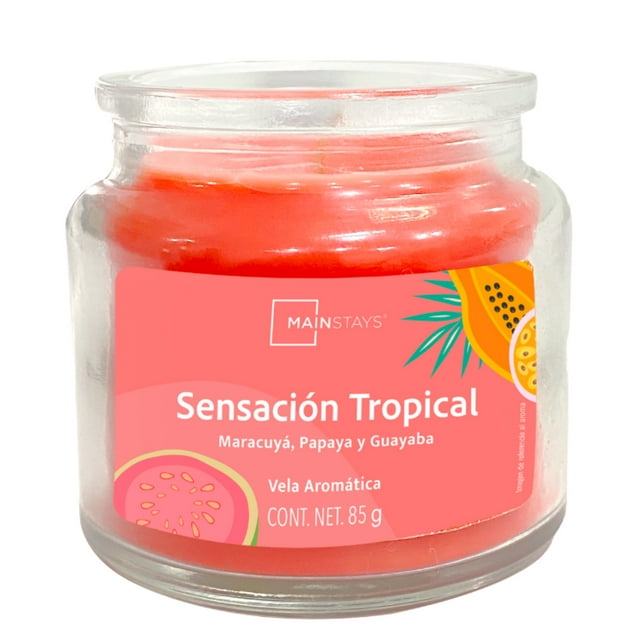 Vela Mainstays Sensación Tropical 85 g en frasco de vidrio con cera naranja, aromática con fragancias de maracuyá, papaya y guayaba, diseñada para ambientar y decorar espacios pequeños y medianos con hasta 20 horas de duración, también adecuada para reutilizar el frasco tras su uso.
