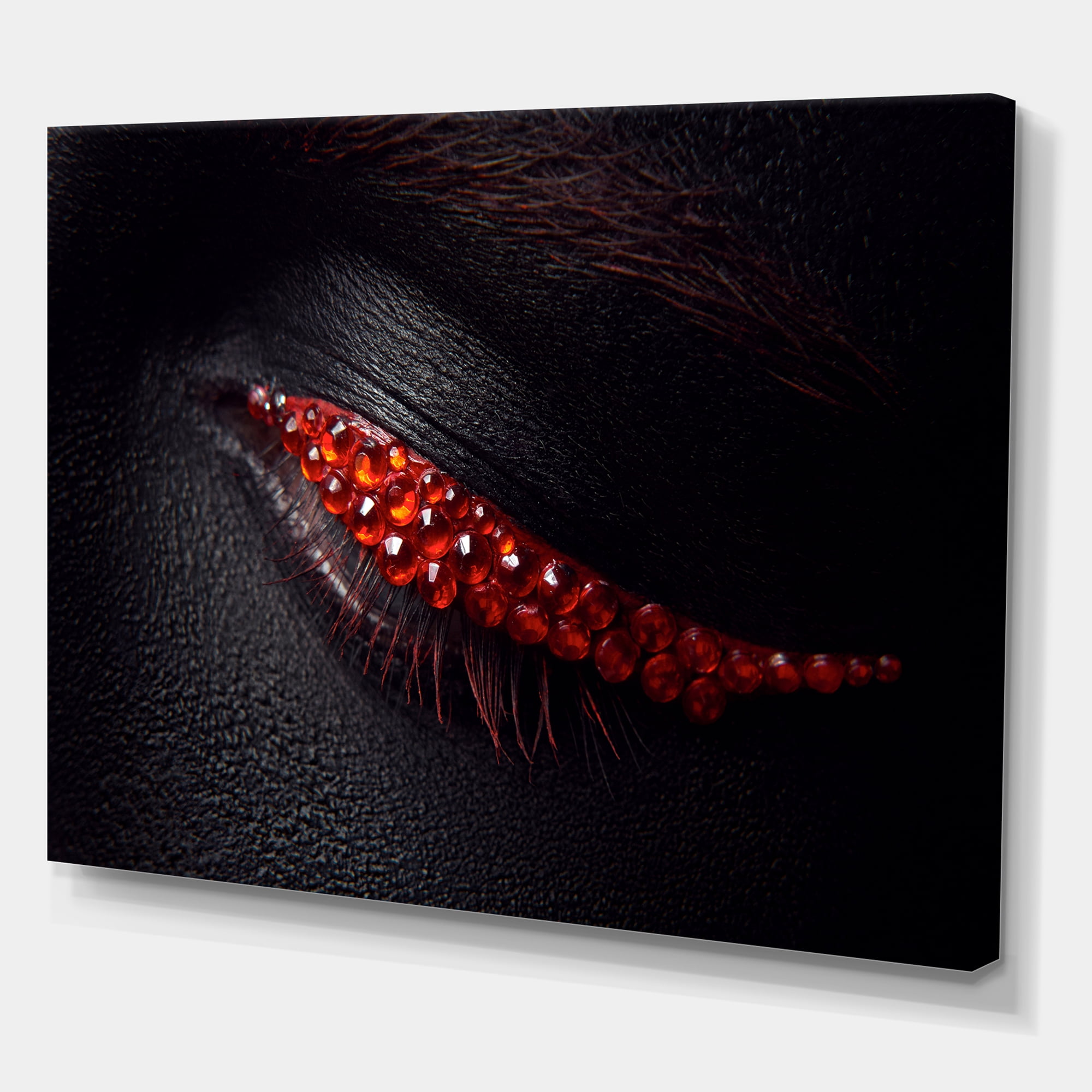Designart ' Beautiful Black Skin Female Eye With Red Diamonds ' Modern Canvas Wall Art Print