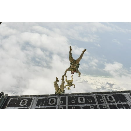 Members of the 7th Special Forces Group perform a high-altitude, low-opening jump from an MC-130P Co Poster Print 24 x