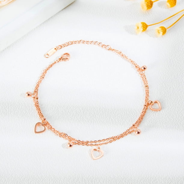 Tobillera de mujer de acero de titanio chapado en oro rosa con doble corazón hueco para mujer a la moda