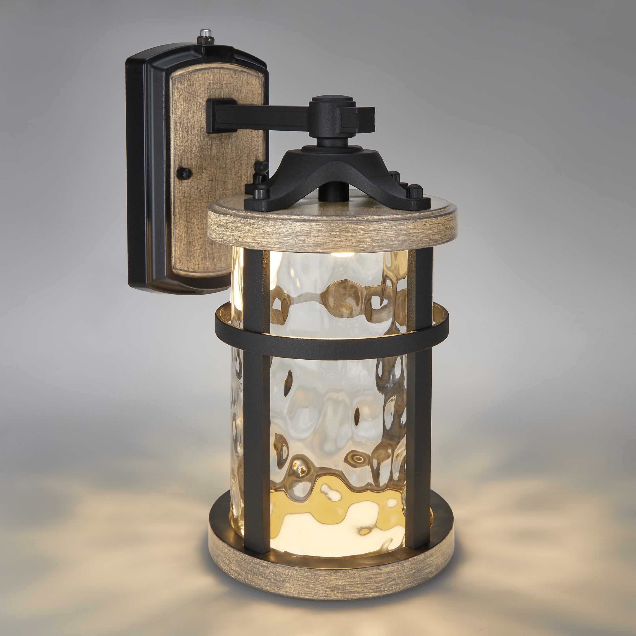 Maxxima LED Outdoor Wall Light, Black w/ Wood Grain Style Finish, Clear Hammered Glass, 800 Lumens, 3000K Warm White, Dusk to Dawn Sensor, Farmhouse Wall Mount Sconce, Rustic Coach Lantern