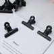thumbnail image 2 of 12 clips metálicos de 63 mm para oficina, papelería y escuela (negros), 2 of 8