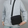 thumbnail image 4 of Black Nylon Sling Bag, Lightweight And Water-Resistant, Practical Storage For Essentials, Ideal For Outdoor Activities, 4 of 6