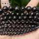 thumbnail image 4 of Cuentas de piedra natural de 6, 8, 10 y 12 mm, color negro y dorado, cuentas redondas de ágata para hacer joyas, pulseras y collares hechos a mano, 15'', 4 of 5
