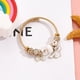 thumbnail image 1 of [Disponible Listo] Pulseras De Cuentas De Oro De Acero Inoxidable Para Mujeres Estudiantes De Dibujos Animados Cinnamo Bangles, 1 of 4
