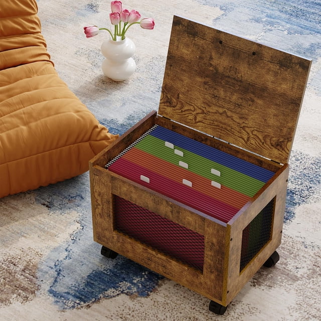 Small File Cabinet Cart Under Desk – Rolling Filing Cabinet for Home Office, featuring a wooden design with a chic hanging file organizer box on wheels. The cabinet is open, displaying multicoloured letter and legal size hanging files. Positioned on a textured rug with a vase of pink tulips and an orange chair in the background.