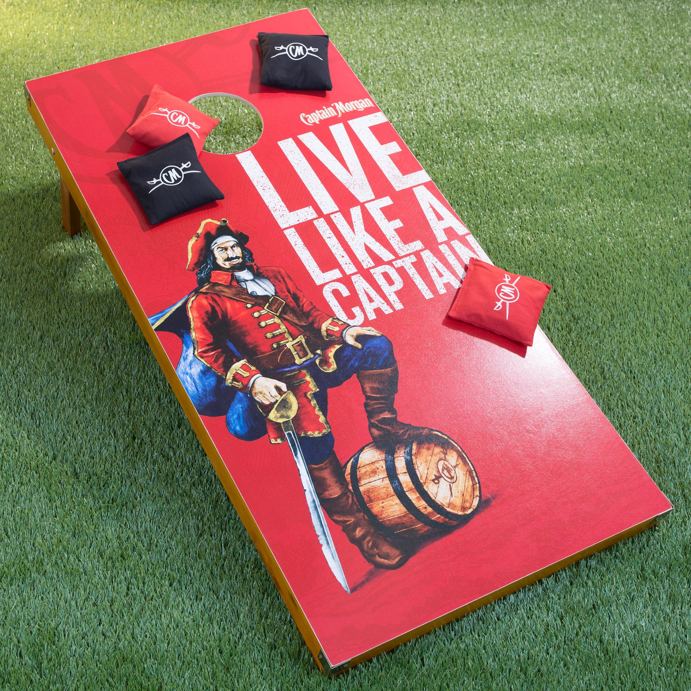 Captain Morgan Cornhole Outdoor Game Set, 2 Wooden Regulation Size Corn Hole Toss Boards with 8 Bean Bags for Adults