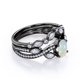 thumbnail image 3 of JeenMata Anillo de Bodas con Bisel en Forma de Chevron, Pavé Infinito de Canal de Moissanita y Ópalo Welo Ovalado de 1,75 Quilates, Engastado en Oro Negro de 18 K sobre Plata, 3 of 6