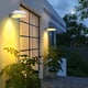thumbnail image 1 of Las mejores luces solares exteriores con sensor de día y noche - Iluminación impermeable para paredes de jardín, patio, puerta principal y decoración de jardín, 1 of 7