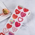 thumbnail image 3 of Adhesivos de papel en forma de corazón con mensajes románticos, ideales para San Valentín. Incluye 3 rollos para decorar regalos y expresar amor., 3 of 7