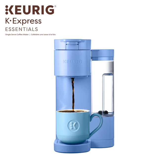 Blue Keurig K-Express Essentials single serve coffee maker pouring hot coffee into a matching blue mug with water reservoir visible.