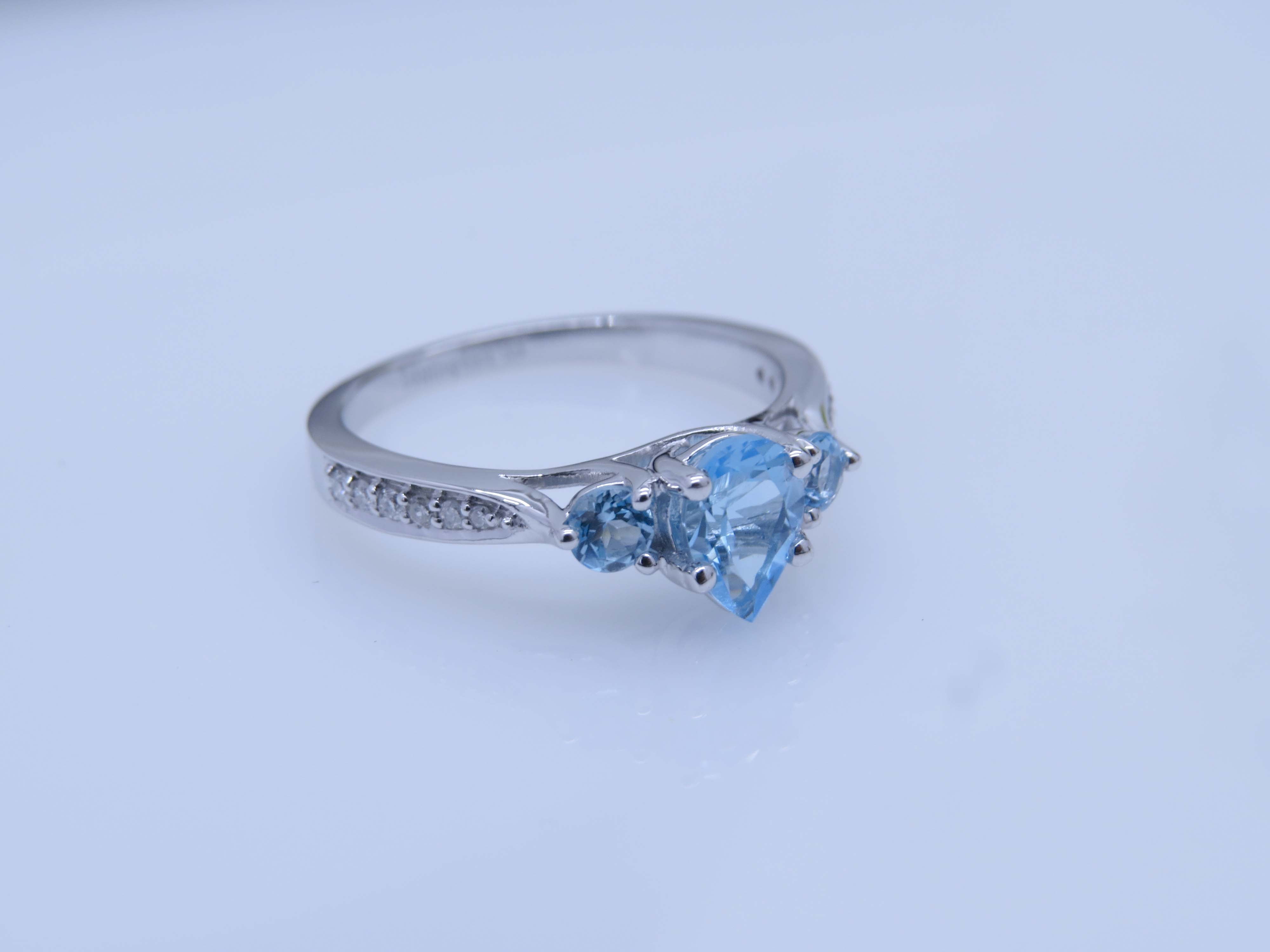 Dazzlingrock Collection 7X5MM Pear Blue Topaz & Round White Diamond 3 Stone Teardrop Engagement Ring for Women (0.10 ctw, Color I-J, Clarity I1-I2) in 18K White Gold, Size 7.5
