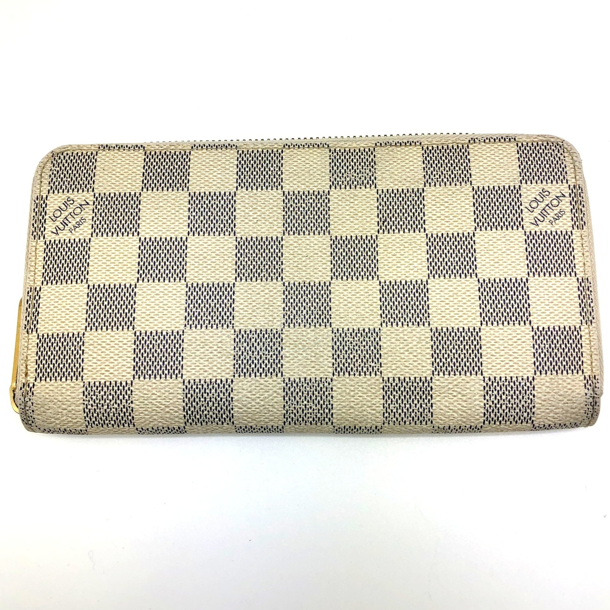 Louis Vuitton compact wallet from seller “Jerseyland020”. Took 21 days to  receive in the U.S., cost $27.76. Has a soft outside touch with  rough/strong inside feel. Nice stitching and know it'll last
