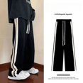 thumbnail image 1 of Otoño nuevo estilo Hong Kong moda versátil de pierna recta pantalones casuales para estudiantes pantalones de pierna ancha a rayas laterales para hombres, 1 of 5