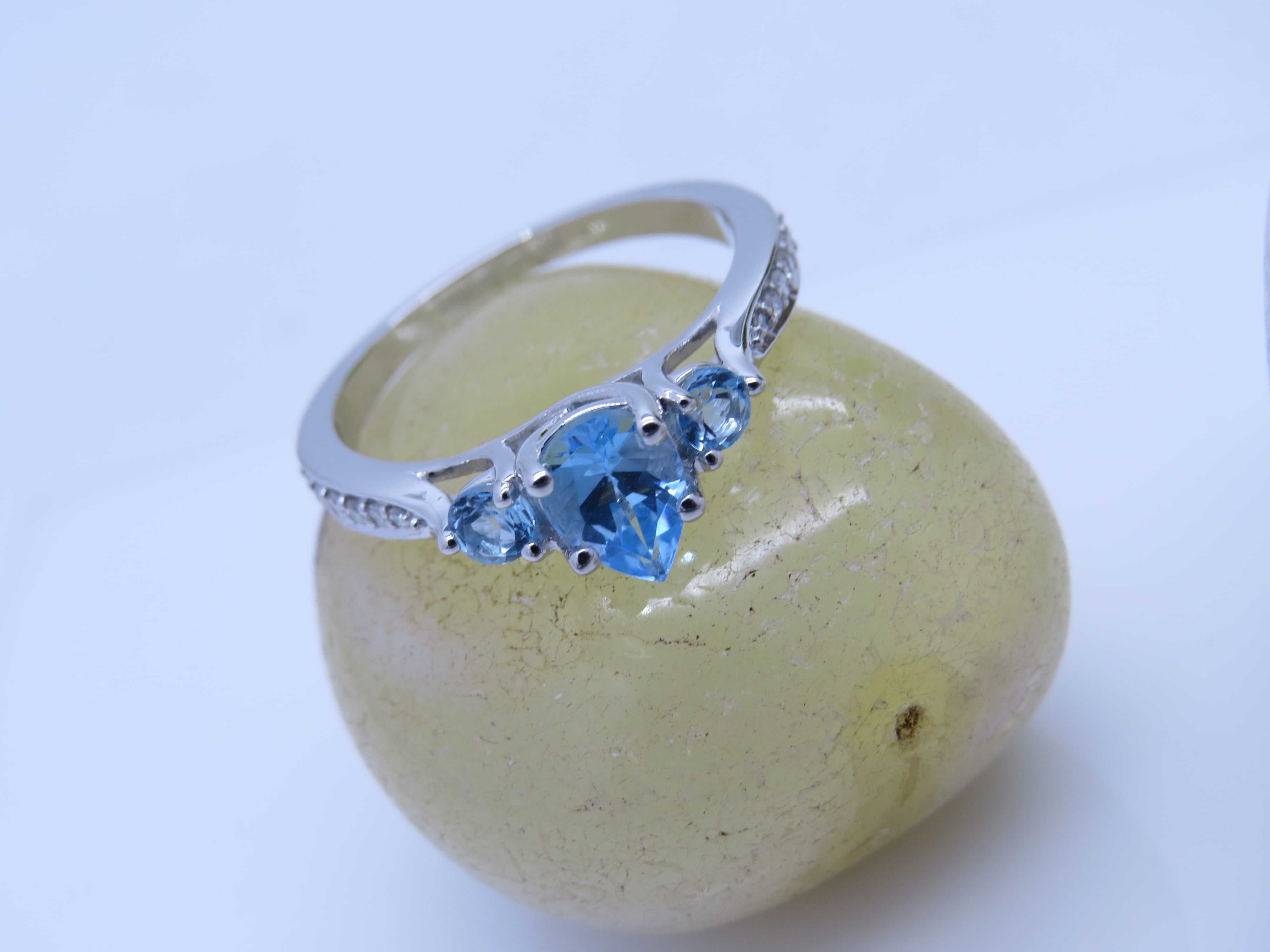 Dazzlingrock Collection 7X5MM Pear Blue Topaz & Round White Diamond 3 Stone Teardrop Engagement Ring for Women (0.10 ctw, Color I-J, Clarity I1-I2) in 18K White Gold, Size 7.5