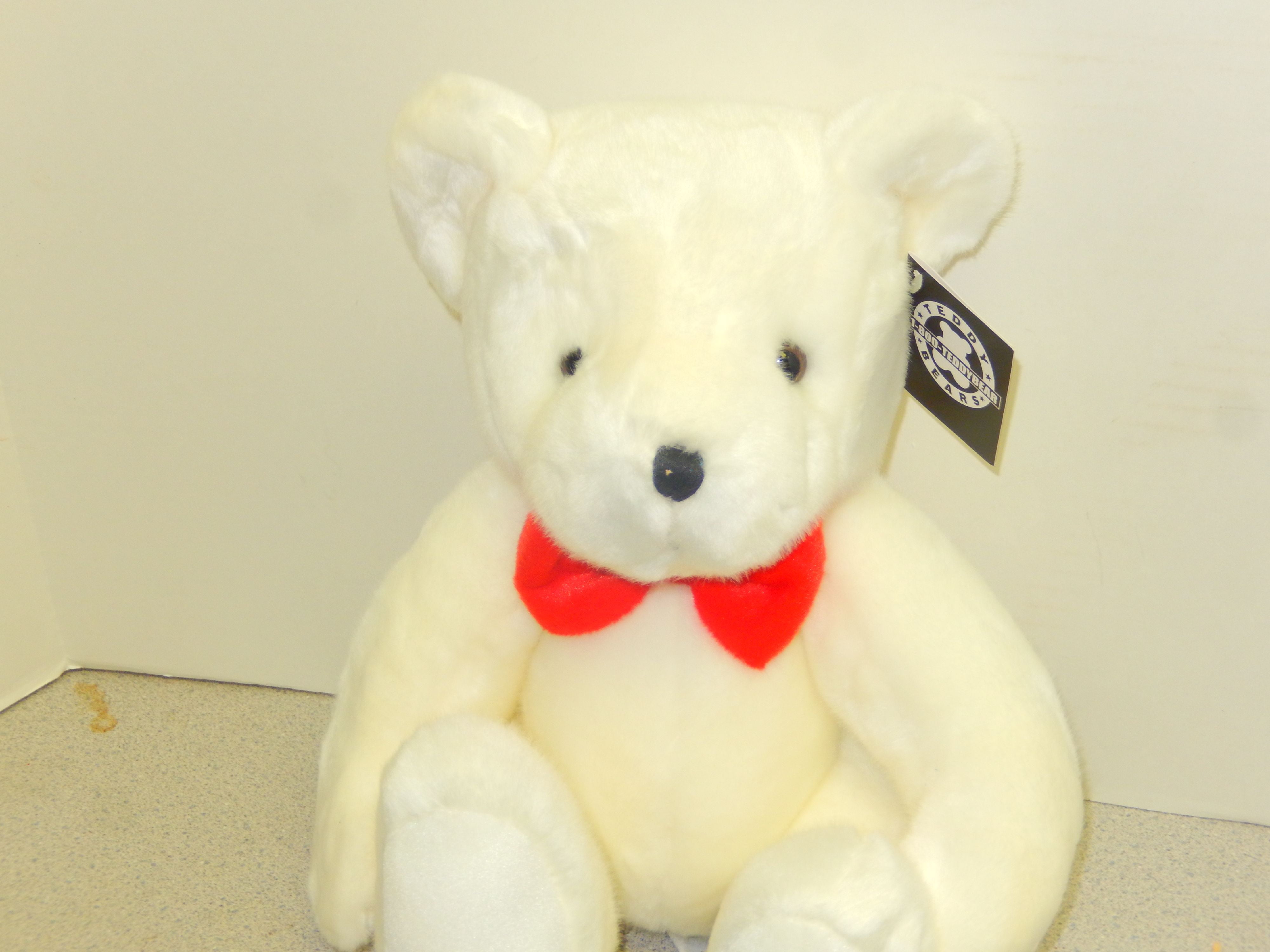 teddy bear with red bow tie