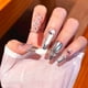 thumbnail image 3 of Uñas postizas largas con diseño francés de lunares, lazo y pedrería, hechas a mano, 3 of 38