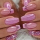 thumbnail image 1 of Uñas postizas cuadradas medianas con punta francesa y acrílico rosa brillante, 1 of 5